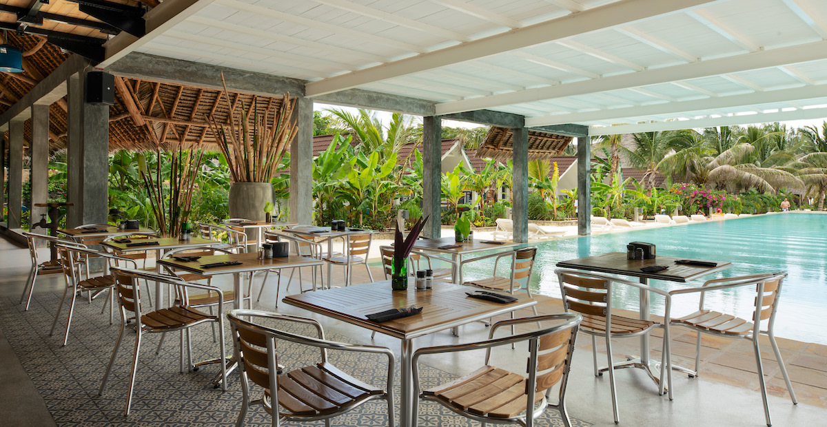 Restaurant dining area facing front pools at Fun Beach Hotel Zanzibar