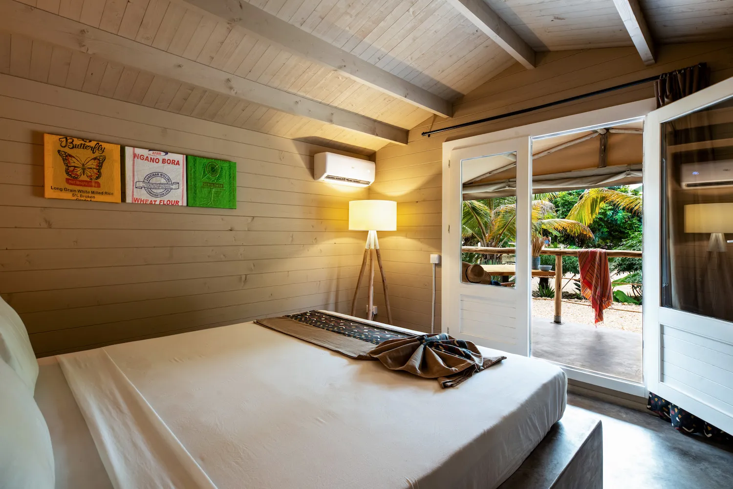 Zanzibar hotel La Luna Suite Apartments bedroom with double doors out to veranda Our Zanzibar Hotel Group