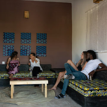 Our Zanzibar Nyumbani Residence guests socialising in apartment lounge area