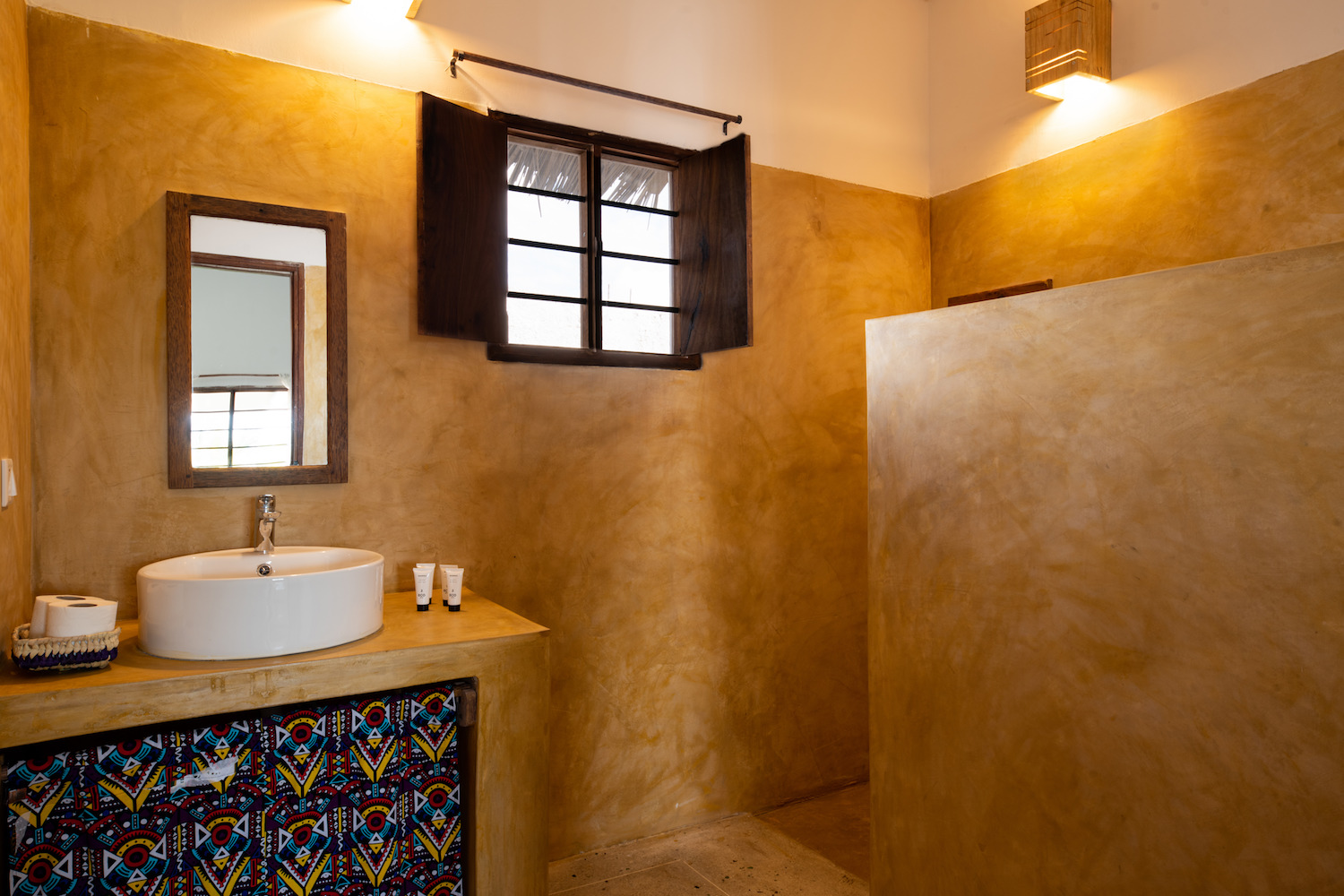 Our Zanzibar Group Nyumbani Residence bathroom sink and shower one bedroom apartment
