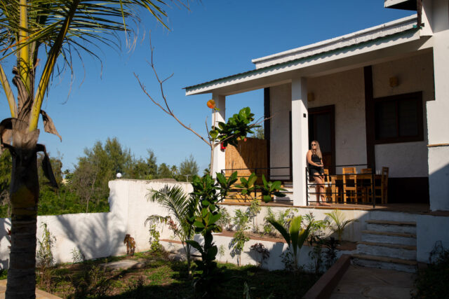 Our Zanzibar Group Nyumbani Residence guest stood on veranda of one bedroom apartment