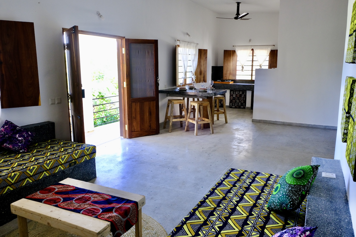 Our Zanzibar Group Nyumbani Residence kitchen dining area and doors out to veranda