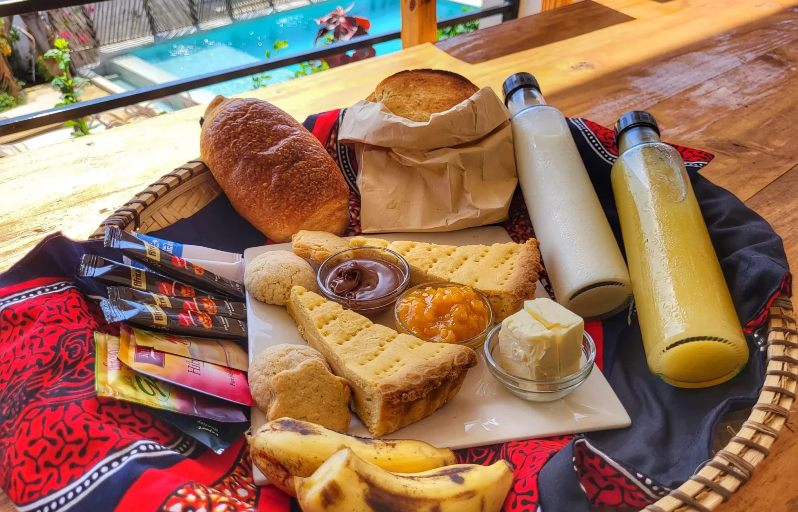 Our Zanzibar Group Nyumbani Residence continental breakfast basket with food and drinks